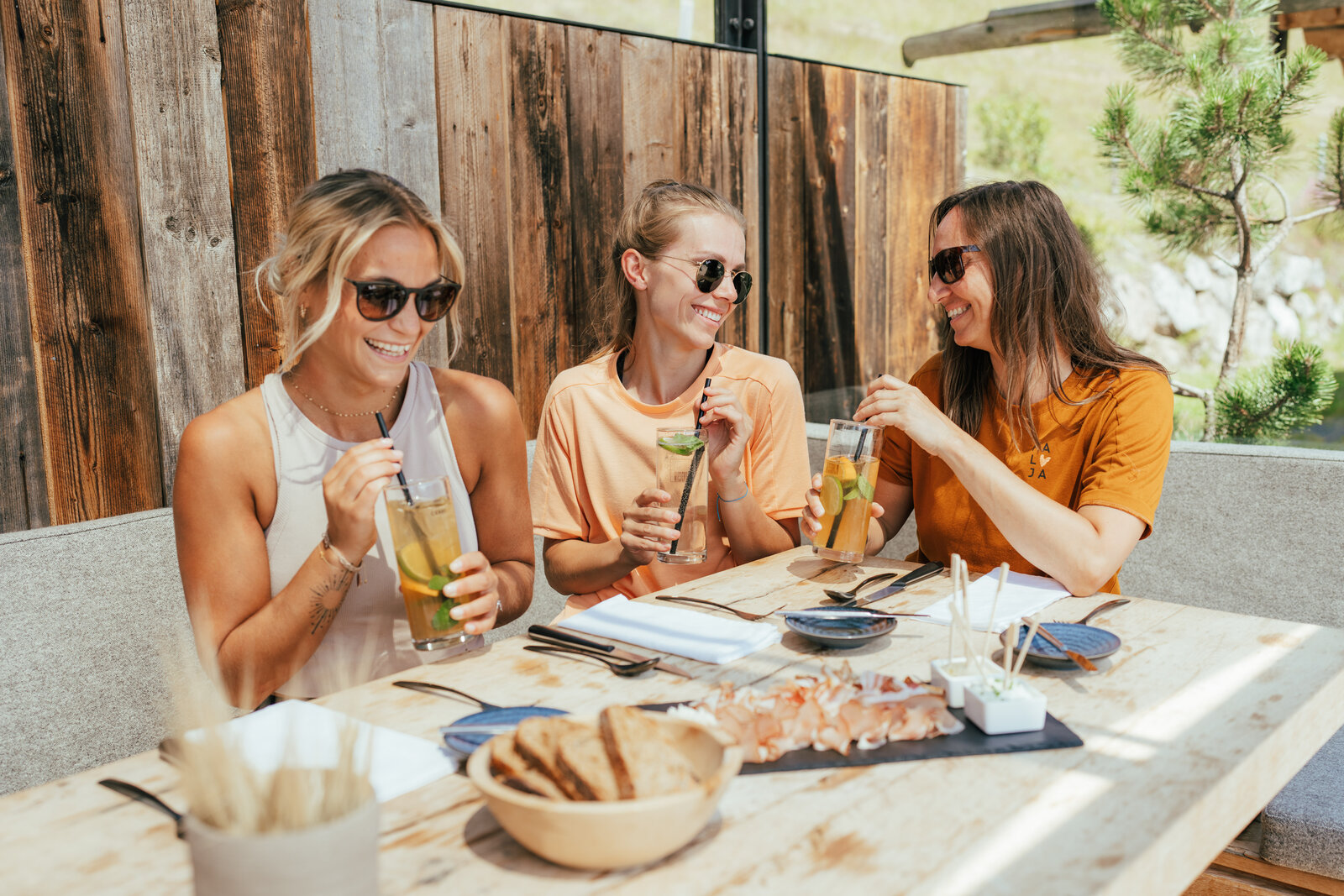 Hinterglemm in summer, friends enjoying drinks on a mountain terrace