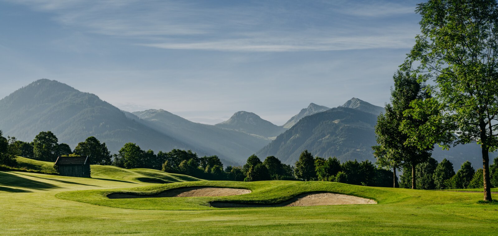 Kitzbühel in summer, a golf course with mountain views