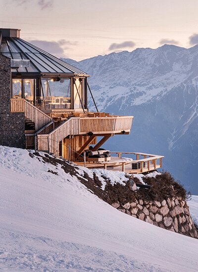 Leogang in winter, a mountain-top lodge at sunset